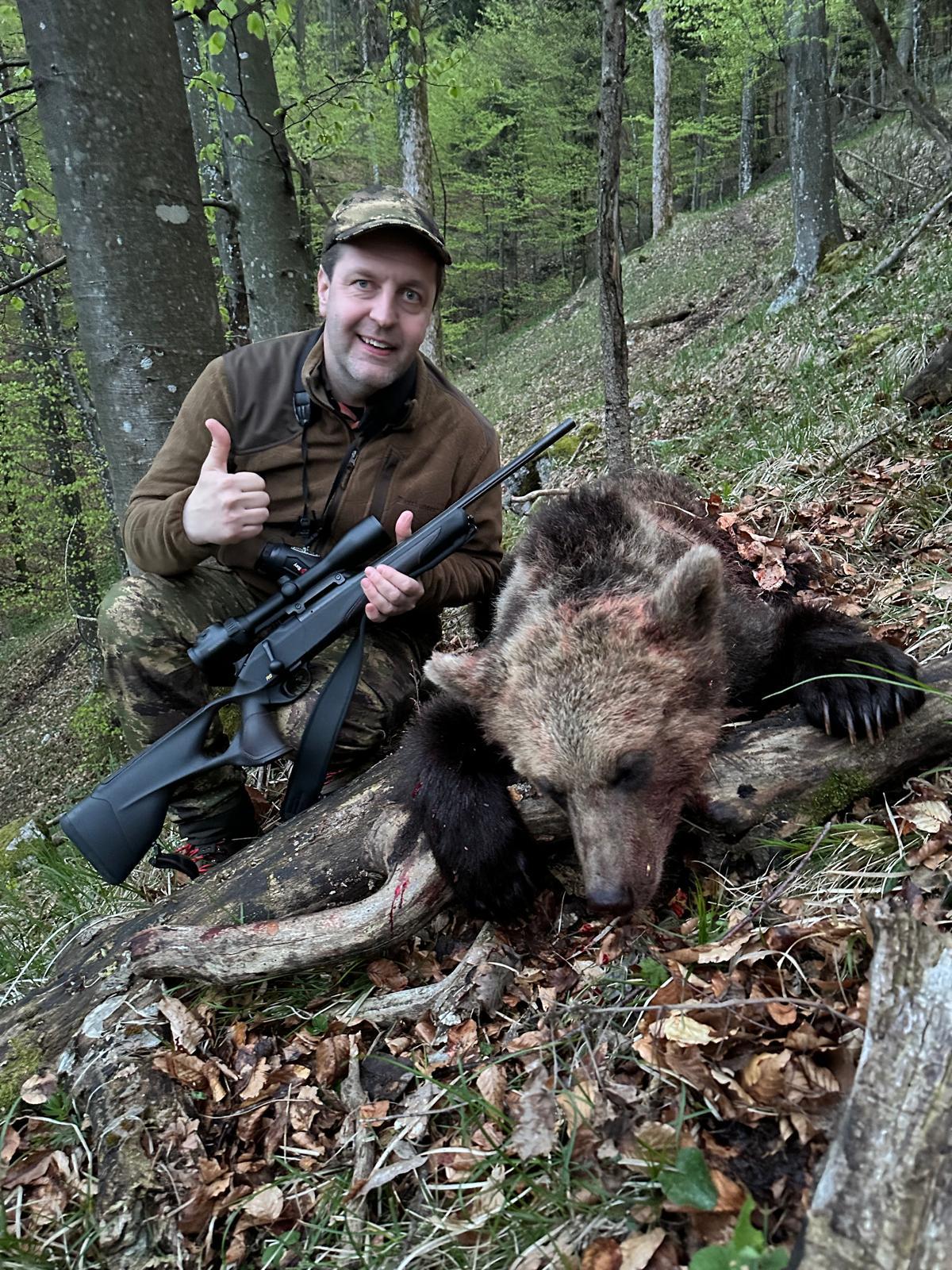 hunter with a bear